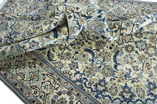 Surface texture of 2000s Nain rug with natural Wool and intricate pattern