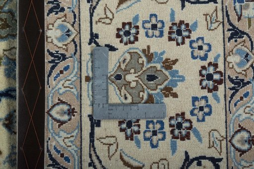 Backside of handmade 2000s Nain rug showing knot structure and weave density