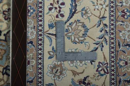 Backside of handmade 2000s Nain rug showing knot structure and weave density