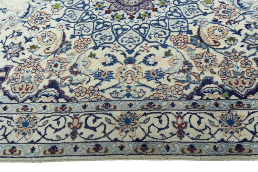 Corner detail of 2000s Nain rug showing border pattern and Wool pile