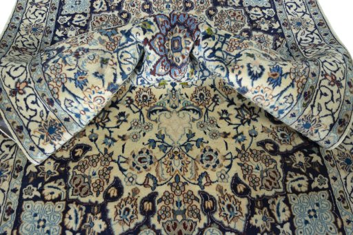 Surface texture of 2000s Nain rug with natural Wool and intricate pattern