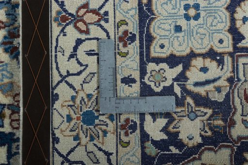 Backside of handmade 2000s Nain rug showing knot structure and weave density