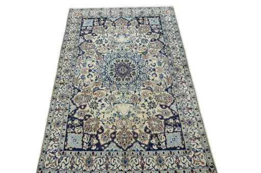 Surface texture of 2000s Nain rug with natural Wool and intricate pattern