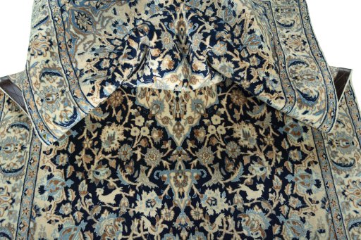 Surface texture of 2000s Nain rug with natural Wool and intricate pattern