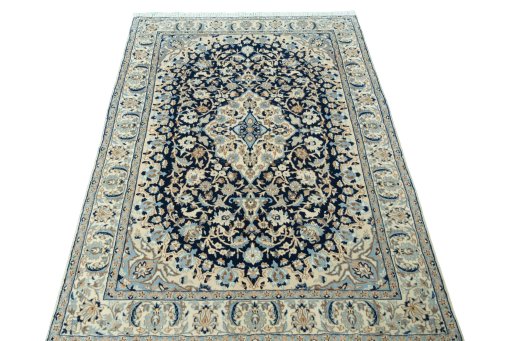 Surface texture of 2000s Nain rug with natural Wool and intricate pattern