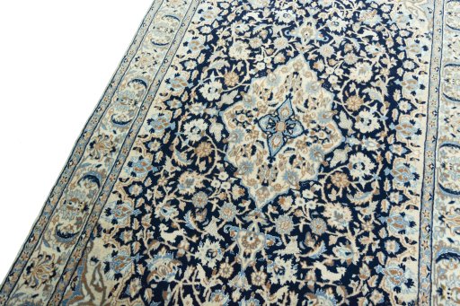 Backside of handmade 2000s Nain rug showing knot structure and weave density