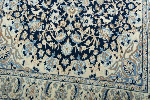Close-up detail of 2000s Nain rug from Iran / Persia showing Wool weave