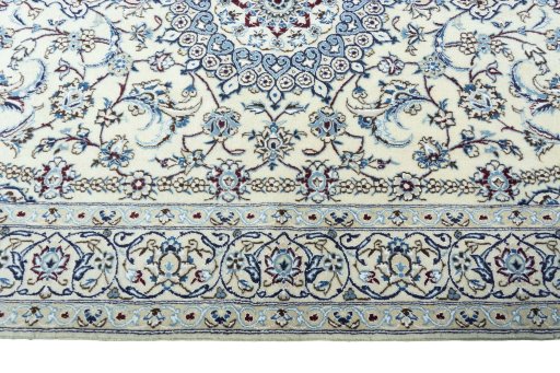 Corner detail of 2000s Nain rug showing border pattern and Wool pile