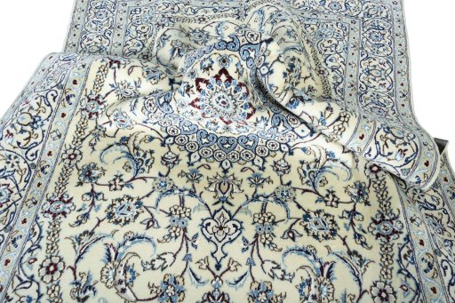 Surface texture of 2000s Nain rug with natural Wool and intricate pattern