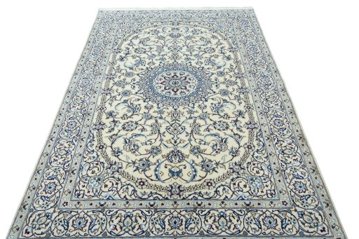 Surface texture of 2000s Nain rug with natural Wool and intricate pattern