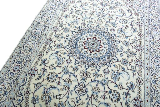 Backside of handmade 2000s Nain rug showing knot structure and weave density