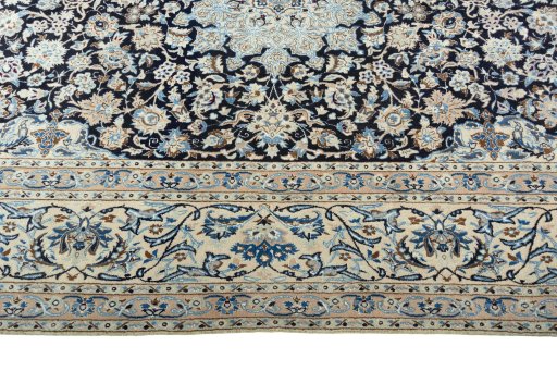 Corner detail of 2000s Nain rug showing border pattern and Wool pile