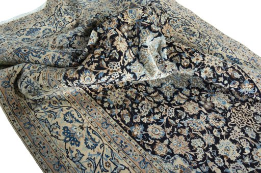 Surface texture of 2000s Nain rug with natural Wool and intricate pattern