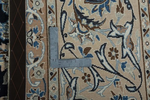Backside of handmade 2000s Nain rug showing knot structure and weave density