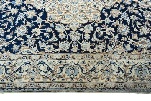 Corner detail of New Nain rug showing border pattern and Wool pile