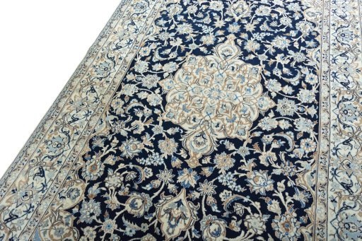 Backside of handmade New Nain rug showing knot structure and weave density