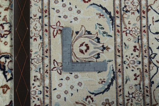 Backside of handmade New Nain rug showing knot structure and weave density