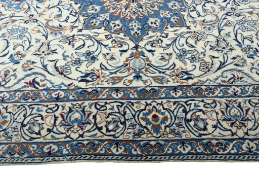 Corner detail of 2000s Nain rug showing border pattern and Wool pile