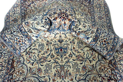 Surface texture of 2000s Nain rug with natural Wool and intricate pattern