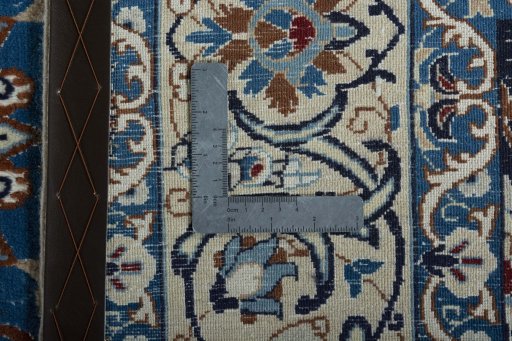 Backside of handmade 2000s Nain rug showing knot structure and weave density