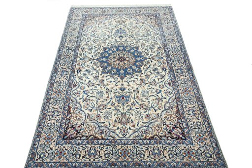 Surface texture of 2000s Nain rug with natural Wool and intricate pattern