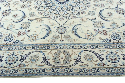 Corner detail of 2000s Nain rug showing border pattern and Wool pile