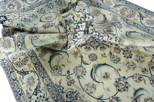Surface texture of 2000s Nain rug with natural Wool and intricate pattern