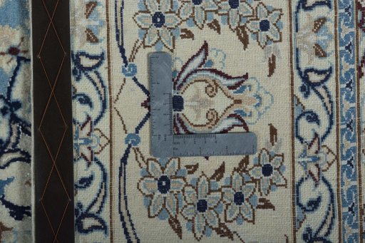 Backside of handmade 2000s Nain rug showing knot structure and weave density