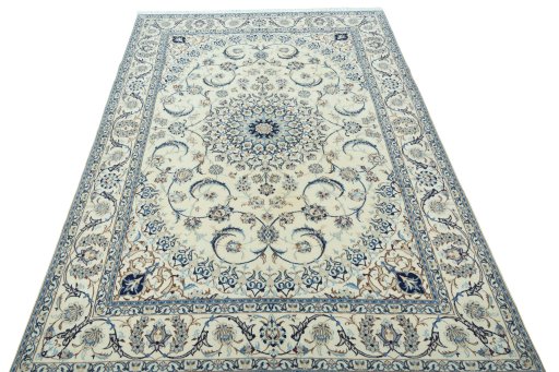 Surface texture of 2000s Nain rug with natural Wool and intricate pattern