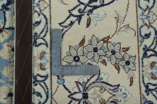 Backside of handmade New Nain rug showing knot structure and weave density