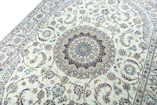 Backside of handmade New Nain rug showing knot structure and weave density