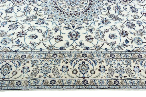 Corner detail of 2000s Nain rug showing border pattern and Wool pile