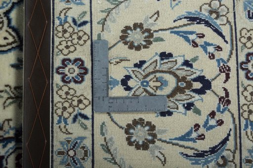 Backside of handmade 2000s Nain rug showing knot structure and weave density