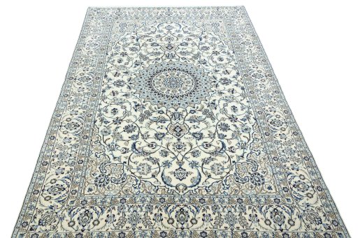 Surface texture of 2000s Nain rug with natural Wool and intricate pattern