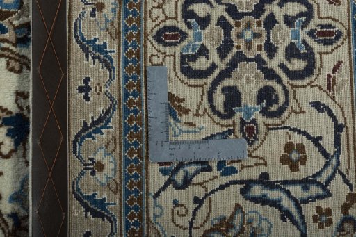 Backside of handmade New Nain rug showing knot structure and weave density