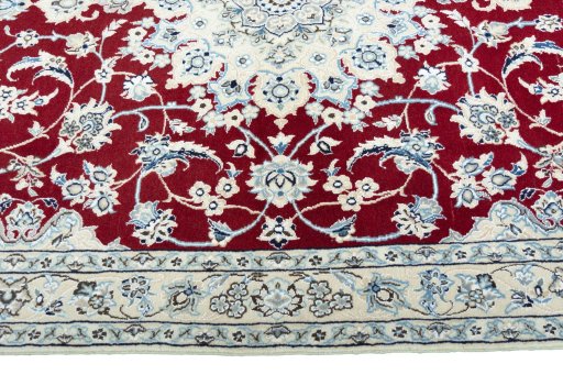 Corner detail of New Nain rug showing border pattern and Wool pile