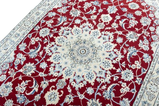 Backside of handmade New Nain rug showing knot structure and weave density