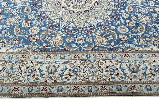 Corner detail of 2000s Nain rug showing border pattern and Wool pile