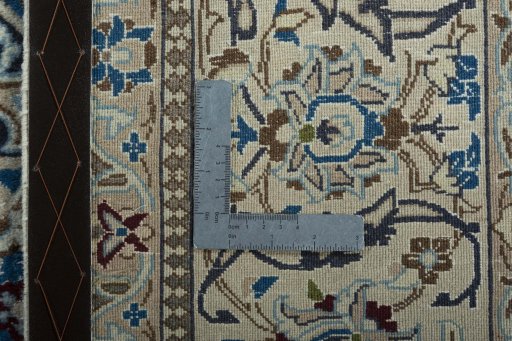 Backside of handmade 2000s Nain rug showing knot structure and weave density