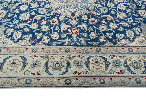 Corner detail of 2000s Nain rug showing border pattern and Wool pile