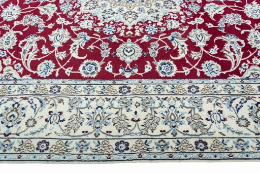 Corner detail of 2000s Nain rug showing border pattern and Wool pile