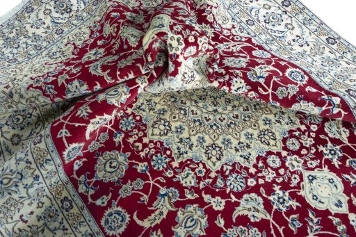 Surface texture of 2000s Nain rug with natural Wool and intricate pattern