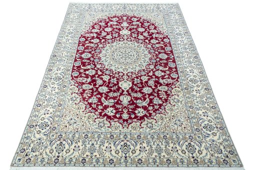 Surface texture of 2000s Nain rug with natural Wool and intricate pattern