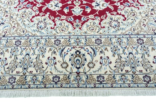 Full view of 2000s Nain rug from Iran / Persia, 305 × 200 cm in Red tones