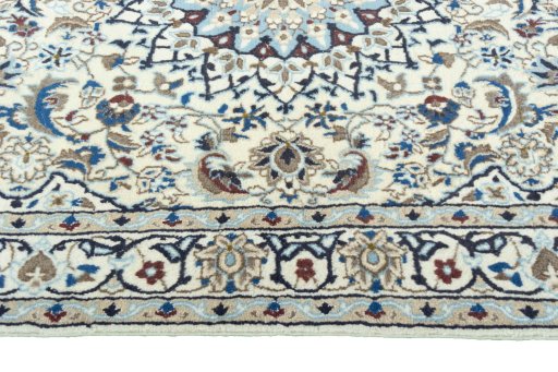 Corner detail of 2000s Nain rug showing border pattern and Wool pile