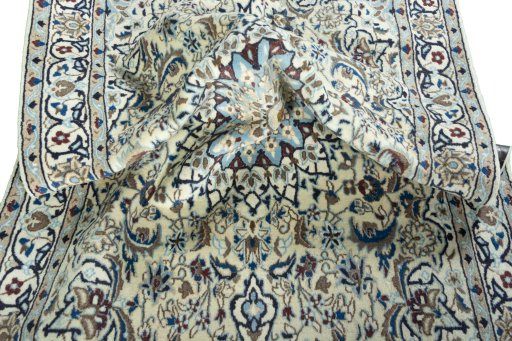 Surface texture of 2000s Nain rug with natural Wool and intricate pattern