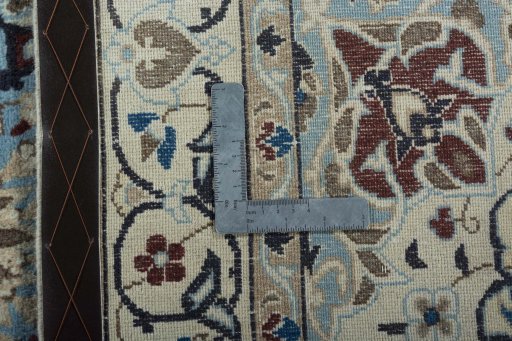 Backside of handmade 2000s Nain rug showing knot structure and weave density