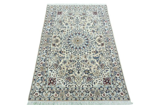 Surface texture of 2000s Nain rug with natural Wool and intricate pattern
