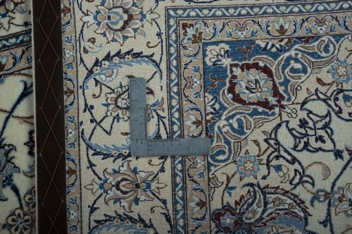Backside of handmade New Nain rug showing knot structure and weave density