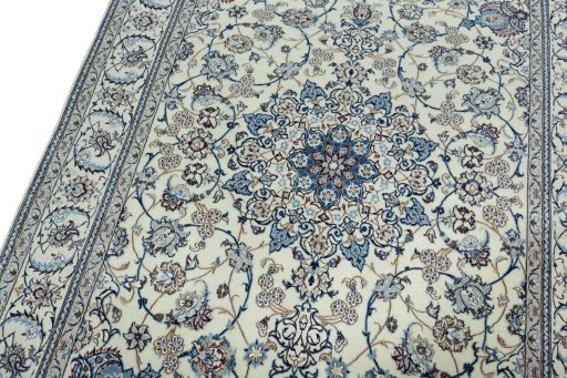 Backside of handmade New Nain rug showing knot structure and weave density